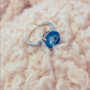 4 carat blue topaz and diamond ring. White gold is the band